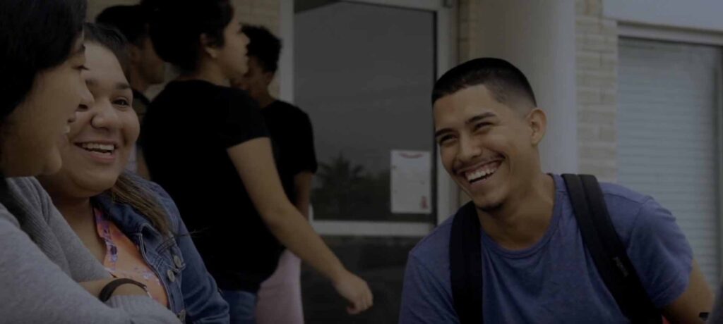 A group of students smiling at Triumph Public High School